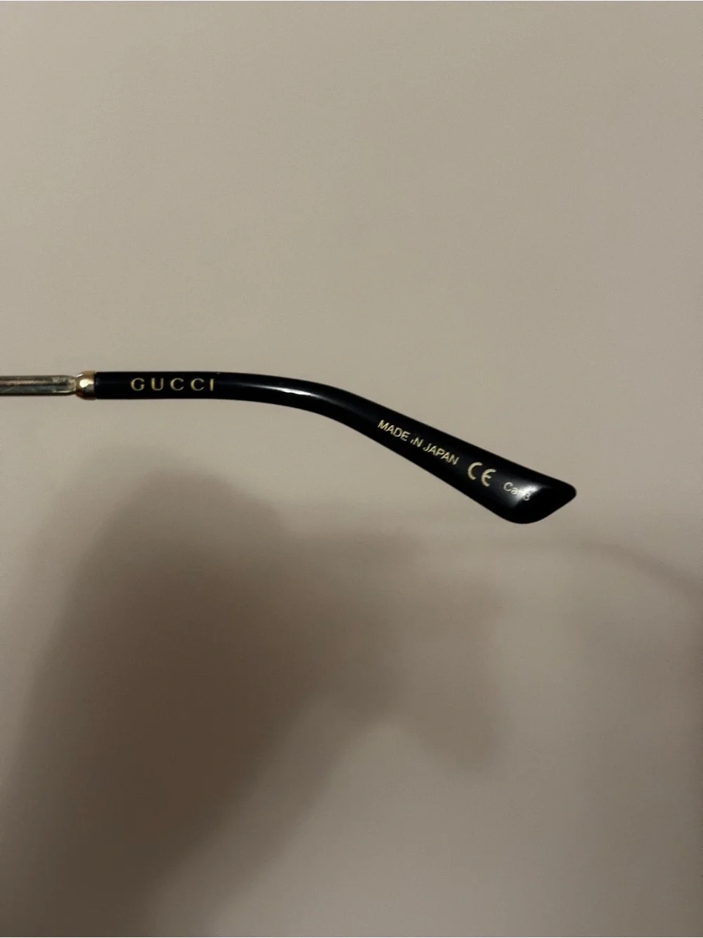 Gucci Women’s Black and Gold Round Sunglasses with Gradient Lenses